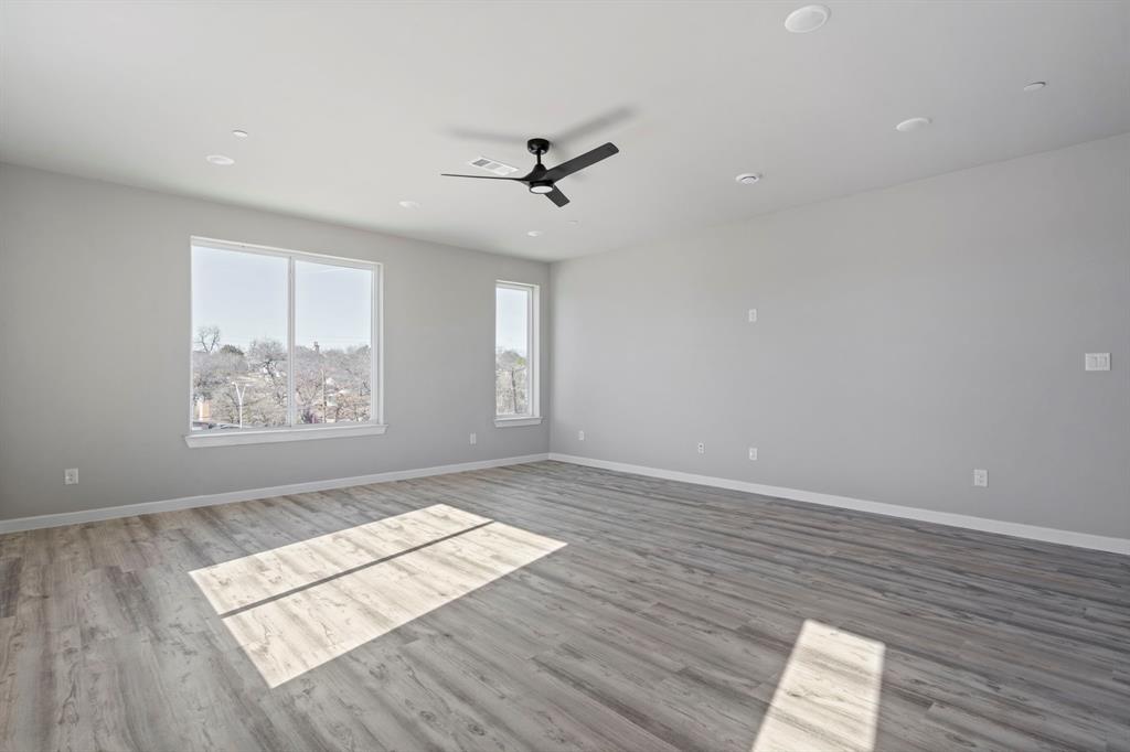 948 Corinth Street, Unit 5 Dallas, TX 75215 - Photo 7 of 28 Spare room with ceiling fan, light wood-style flooring, and recessed lighting