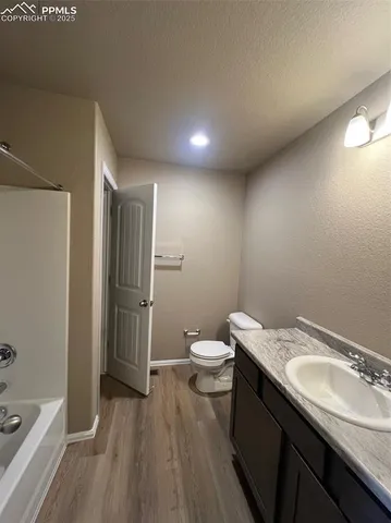 an empty room with a empty space and windows