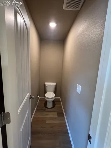 a bathroom with a granite countertop sink and bathtub
