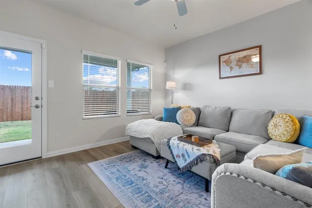 a living room with furniture and a window