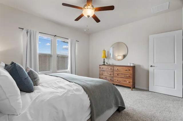 a bedroom with a bed and closet