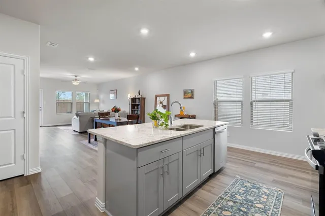 a view of a house with backyard porch and wooden floor