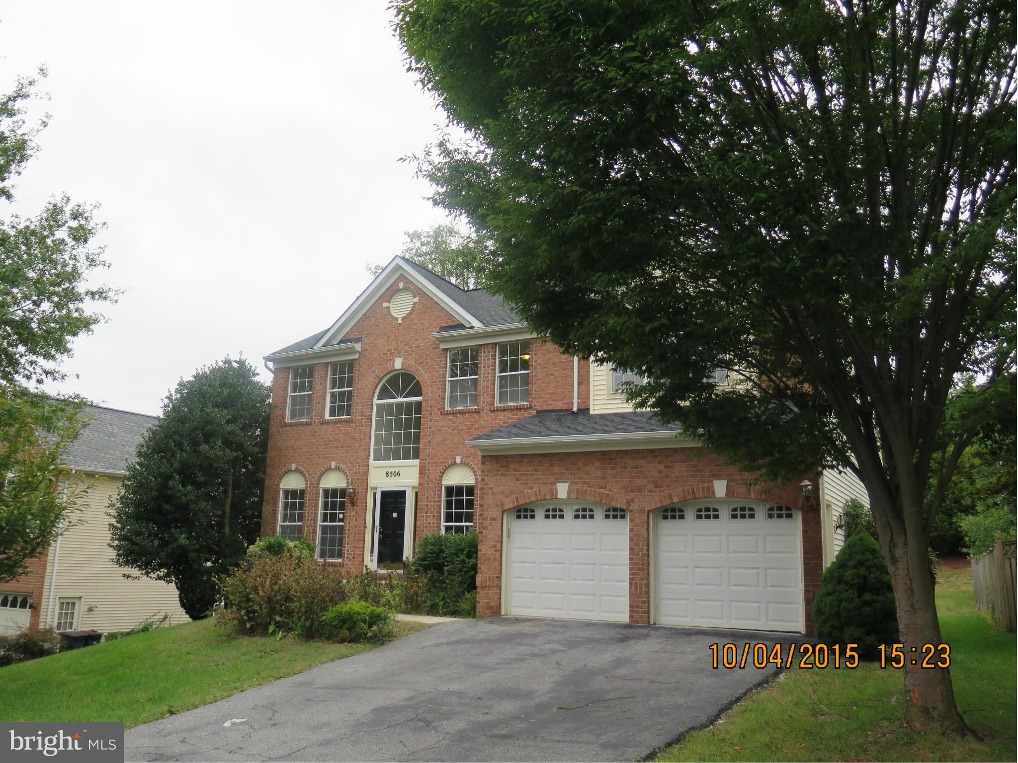 8506 Topaz Court Clinton, MD 20735 - Photo 2 of 30 a front view of a house with a yard and garage