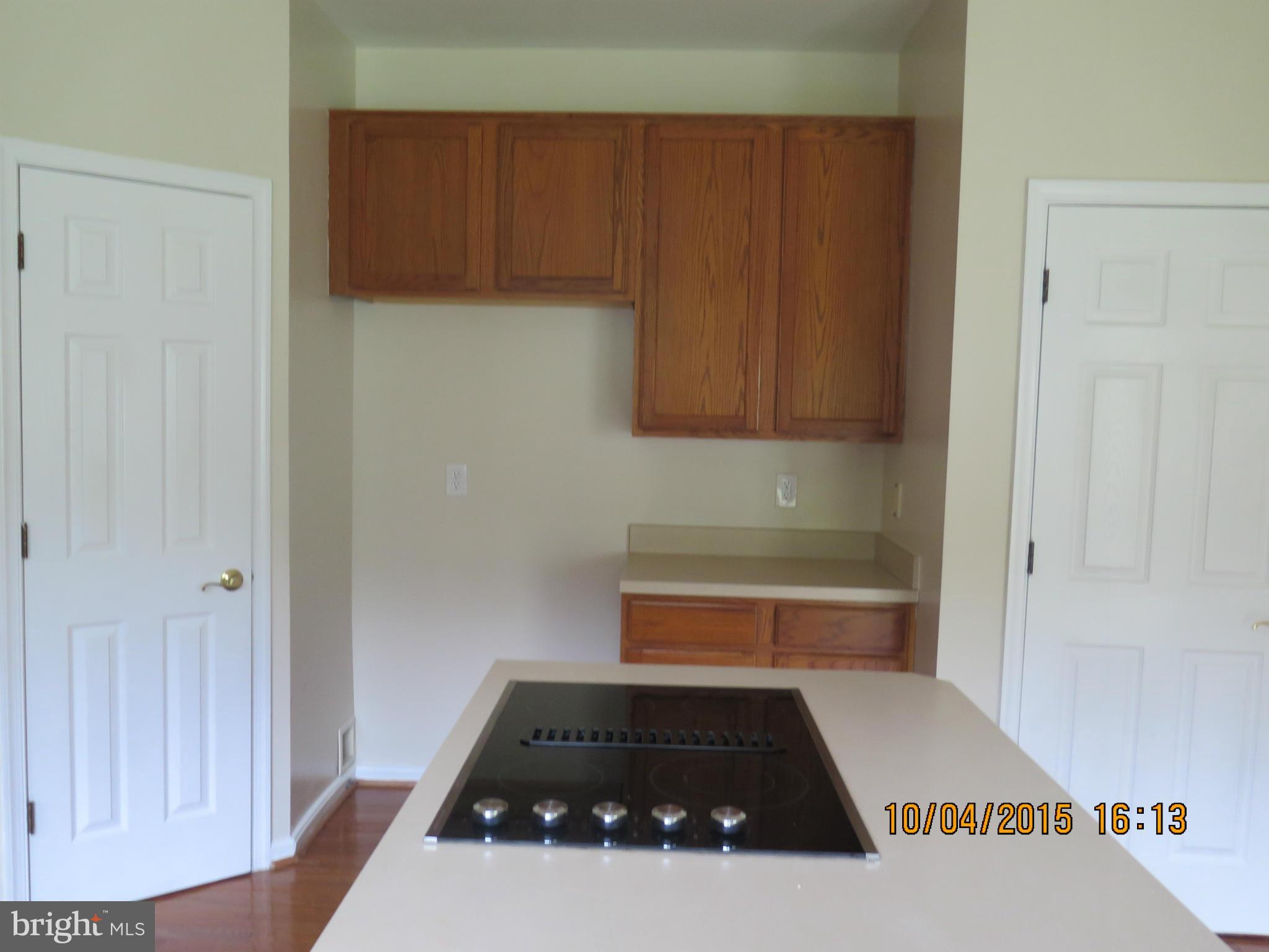 8506 Topaz Court Clinton, MD 20735 - Photo 12 of 30 a kitchen with a sink and cabinets