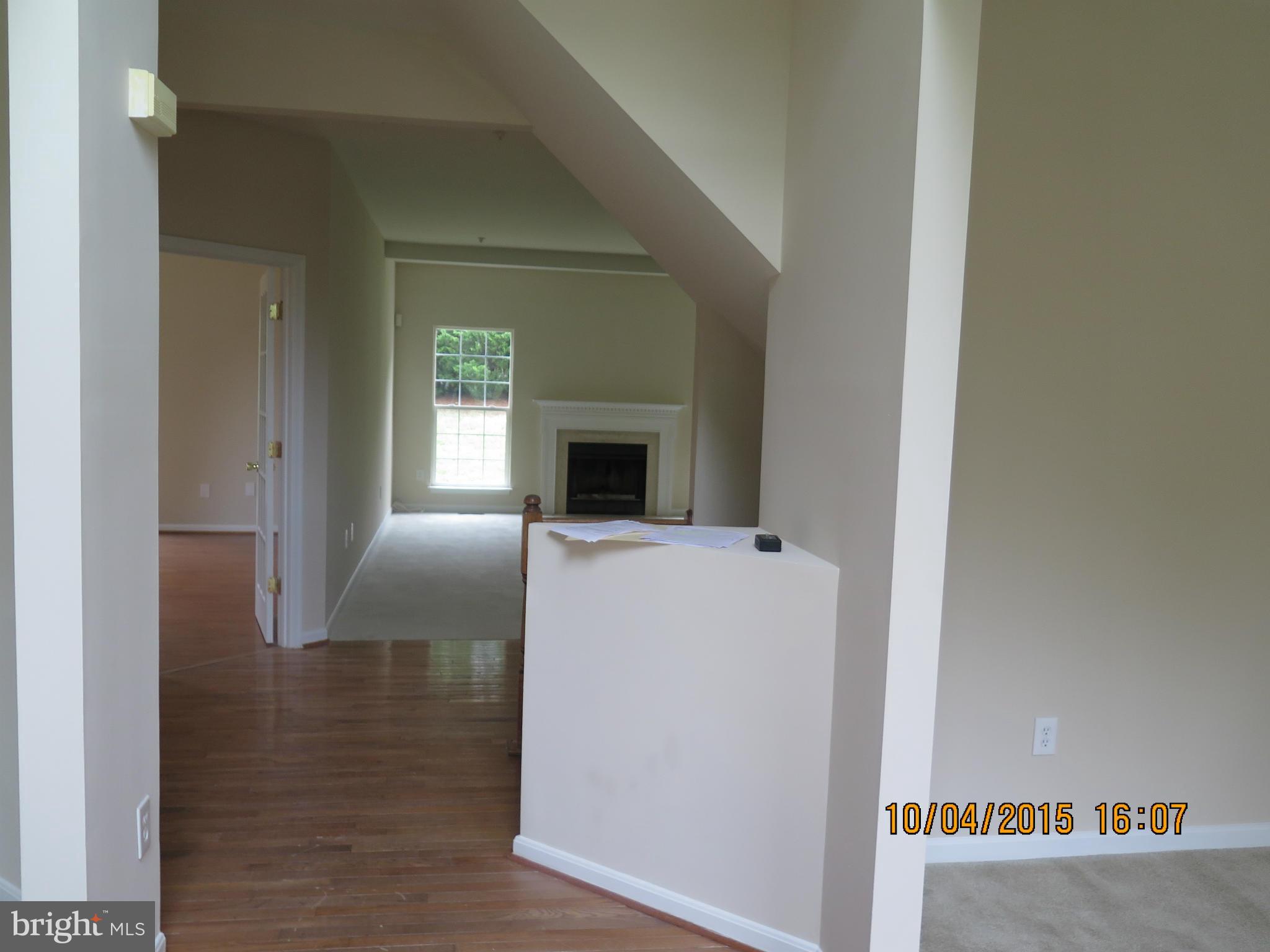 8506 Topaz Court Clinton, MD 20735 - Photo 3 of 30 a living room with furniture and a fireplace