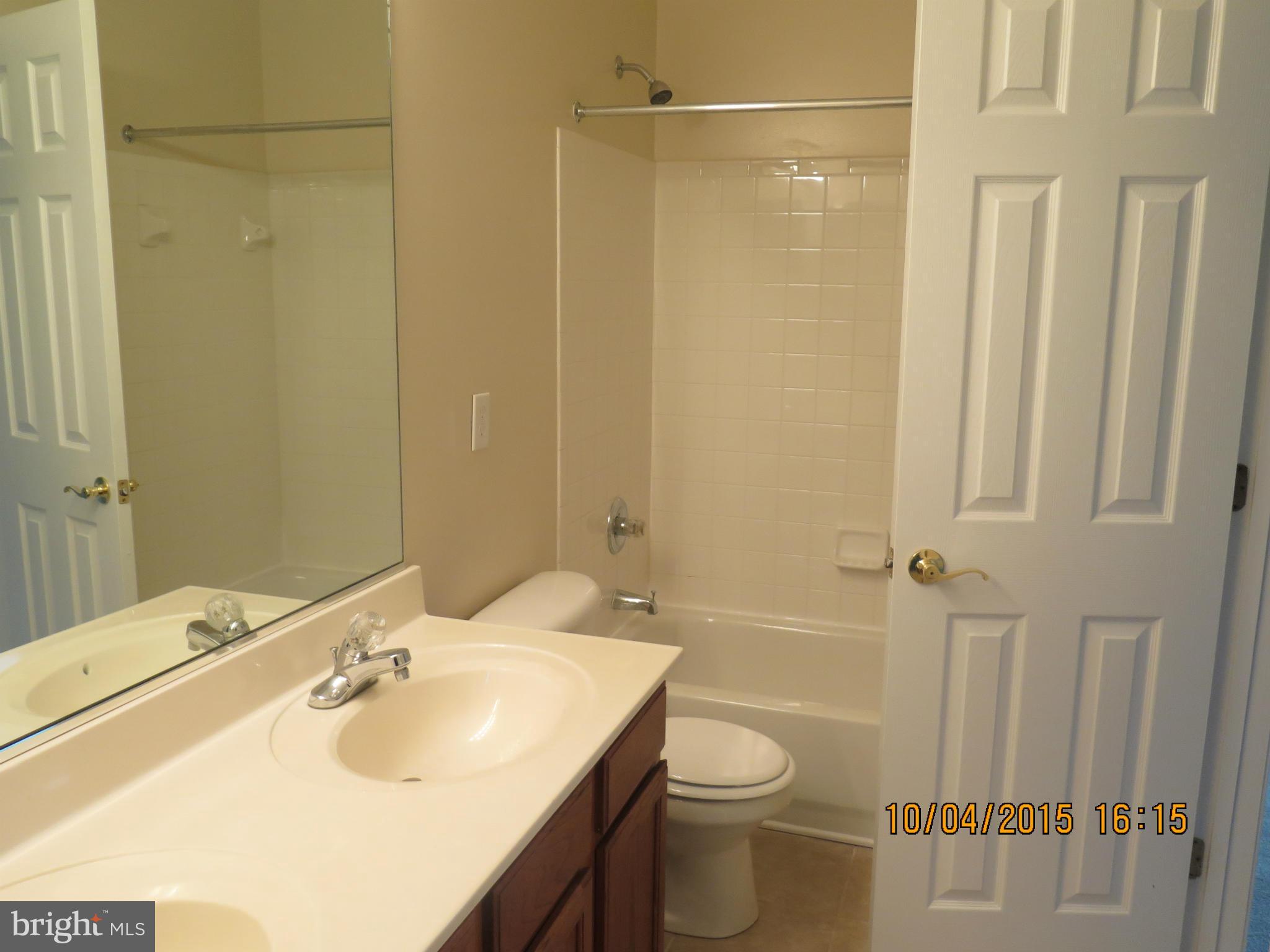 8506 Topaz Court Clinton, MD 20735 - Photo 21 of 30 a bathroom with a sink toilet and shower