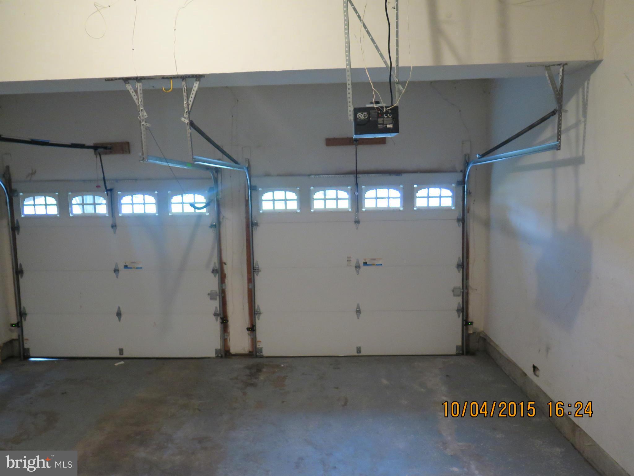 8506 Topaz Court Clinton, MD 20735 - Photo 27 of 30 an empty room with windows and chandelier