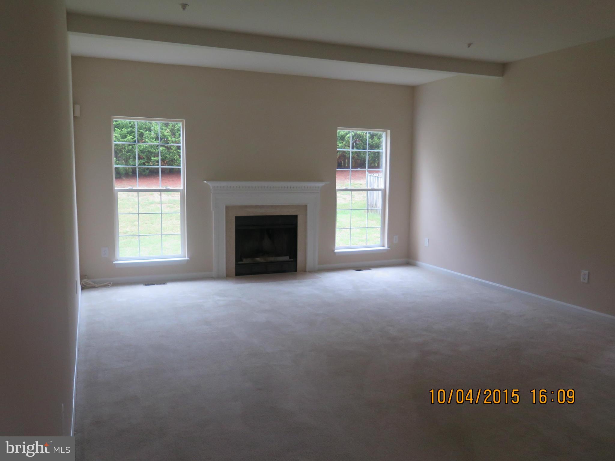 8506 Topaz Court Clinton, MD 20735 - Photo 7 of 30 a view of empty room with a fireplace