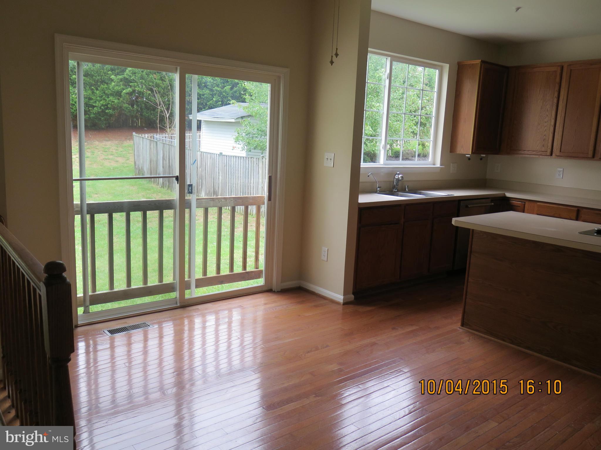 8506 Topaz Court Clinton, MD 20735 - Photo 9 of 30 a view of a kitchen with wooden floor and a window