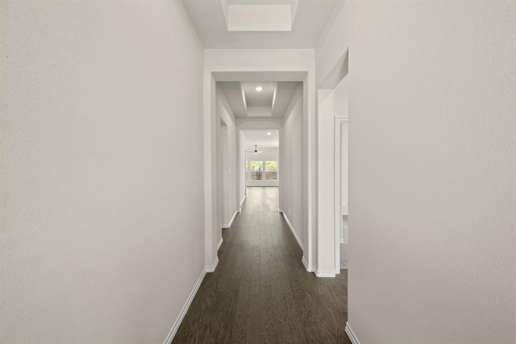 10809 Rothland Street Crowley, TX 76036 - Photo 16 of 30 a view of a hallway with wooden floor
