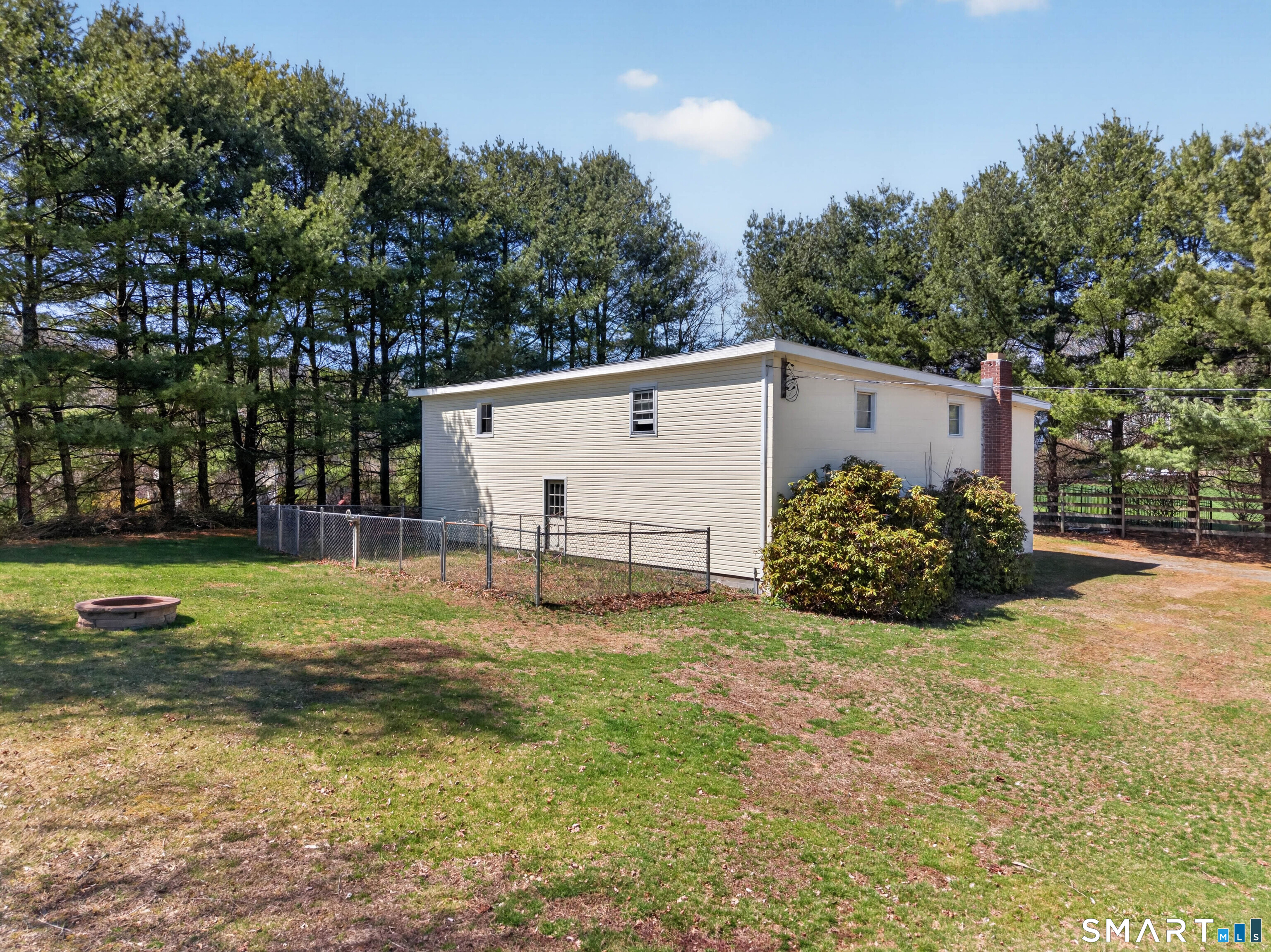 1092 Durham Road Guilford, CT 06437 - Photo 18 of 61 a view of a house with backyard and trees