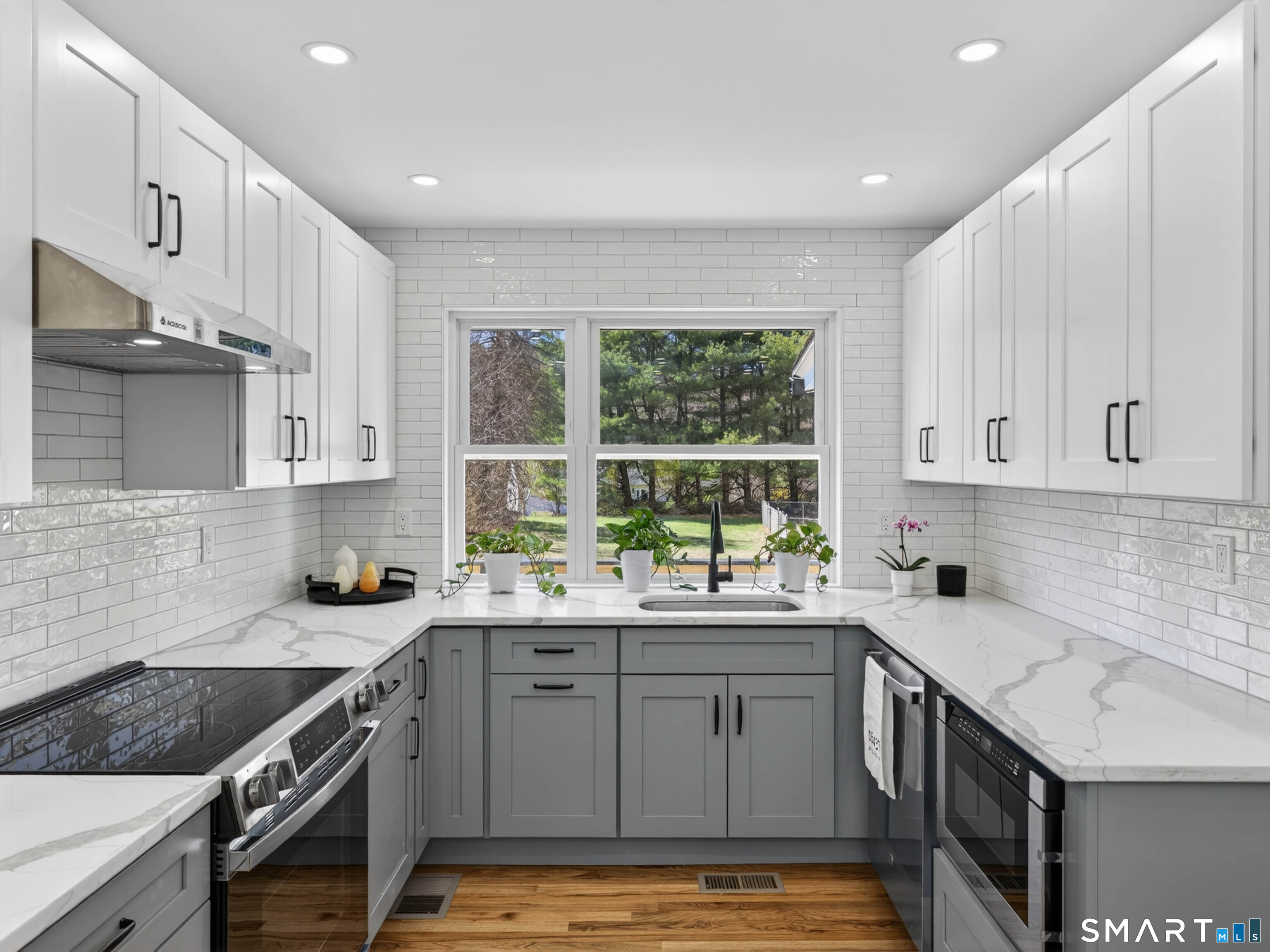 1092 Durham Road Guilford, CT 06437 - Photo 34 of 61 a kitchen with a sink a window and cabinets