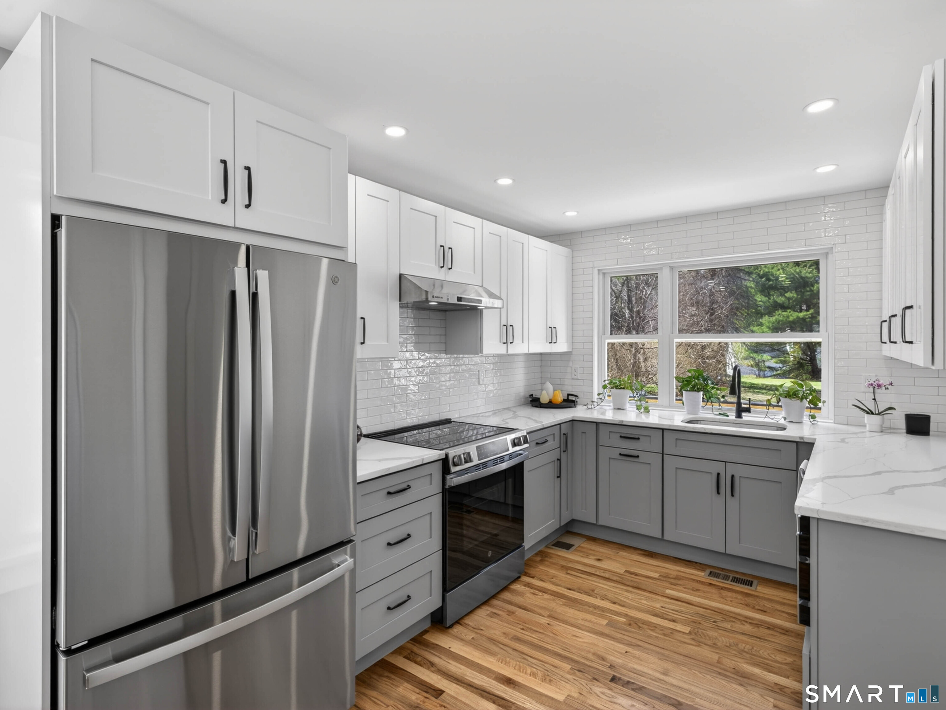 1092 Durham Road Guilford, CT 06437 - Photo 40 of 61 a kitchen with stainless steel appliances granite countertop a stove a refrigerator and a refrigerator