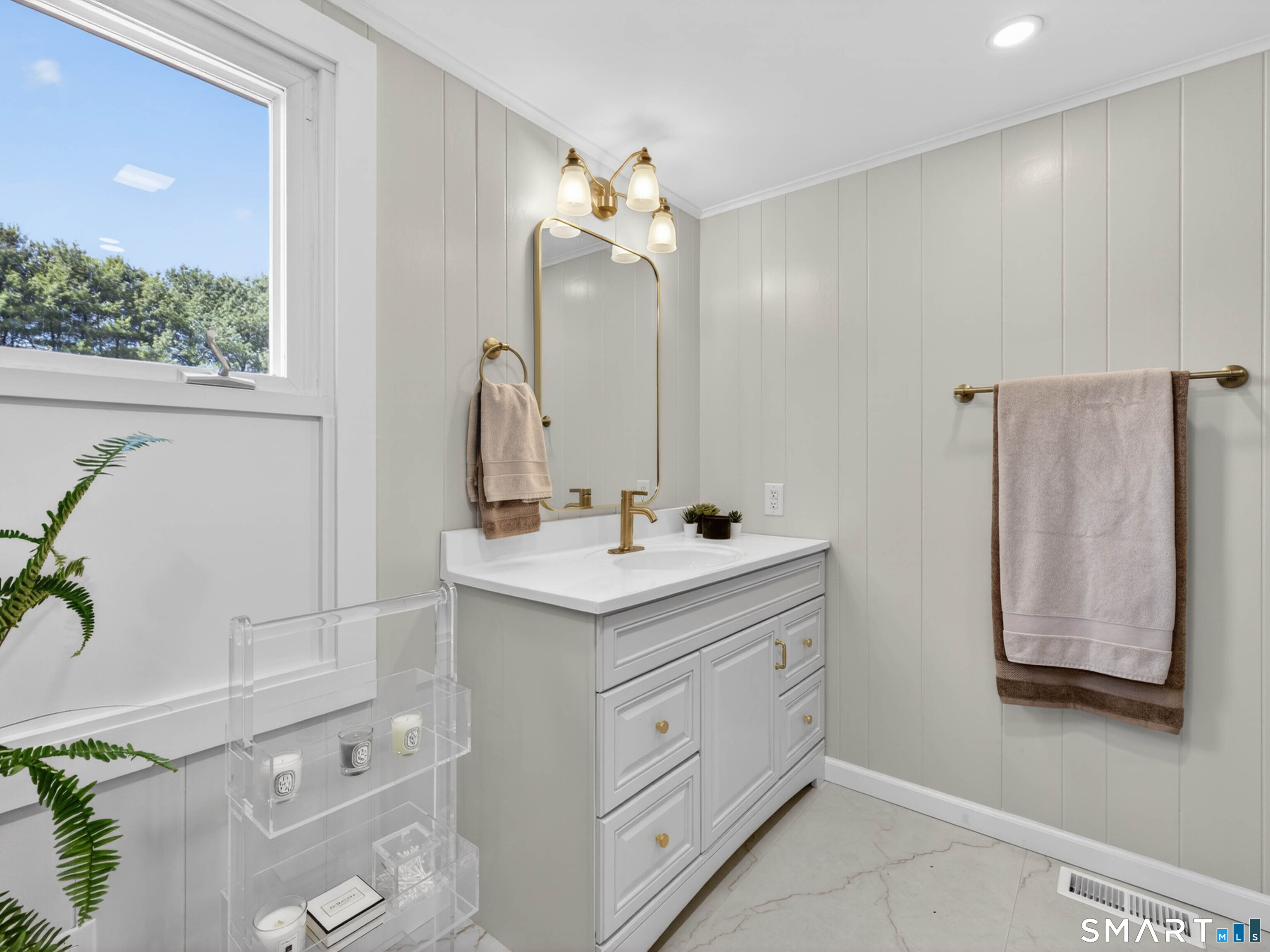 1092 Durham Road Guilford, CT 06437 - Photo 46 of 61 a bathroom with a double vanity sink and a mirror