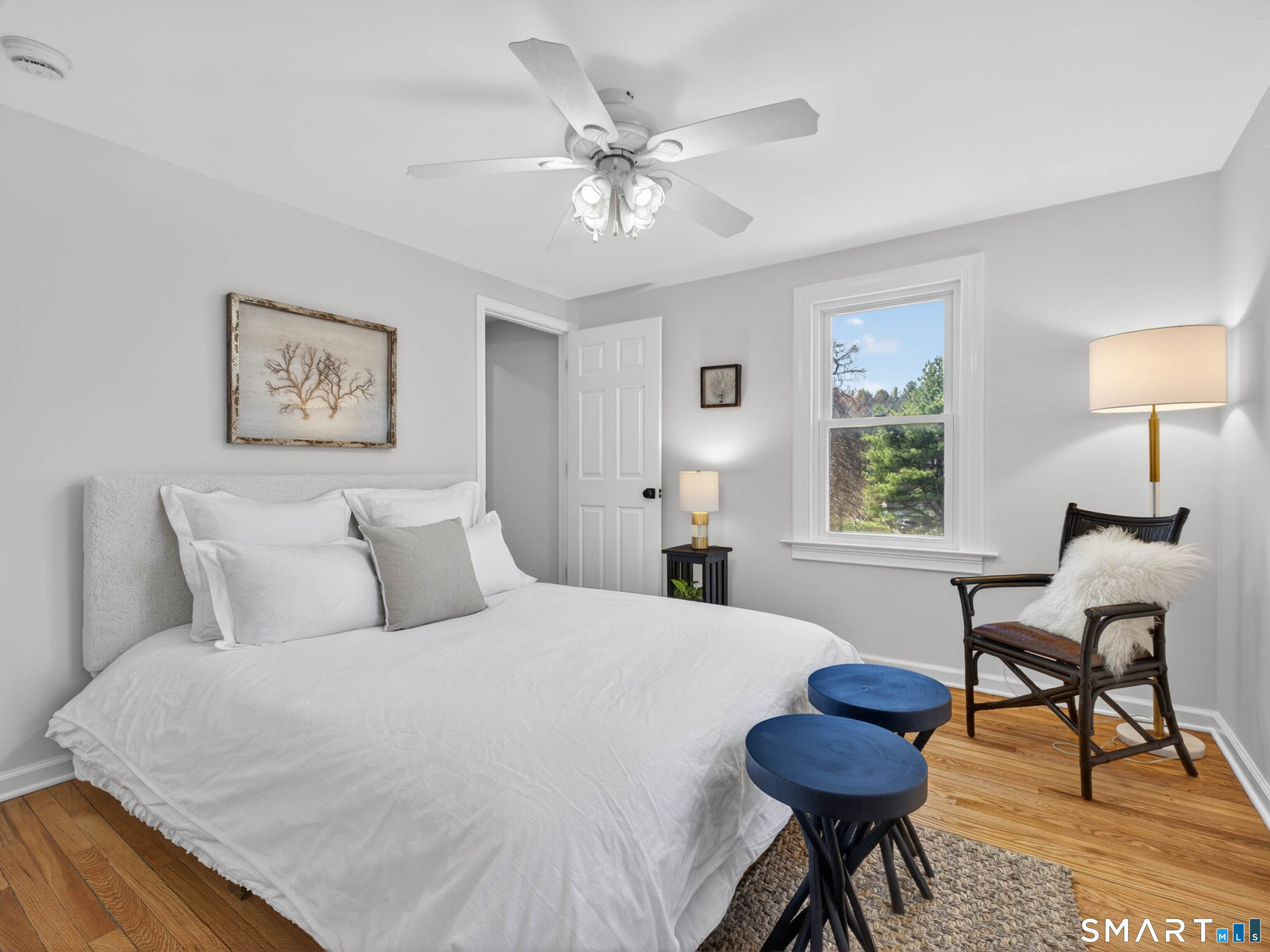 1092 Durham Road Guilford, CT 06437 - Photo 48 of 61 a spacious bedroom with a bed and a chandelier