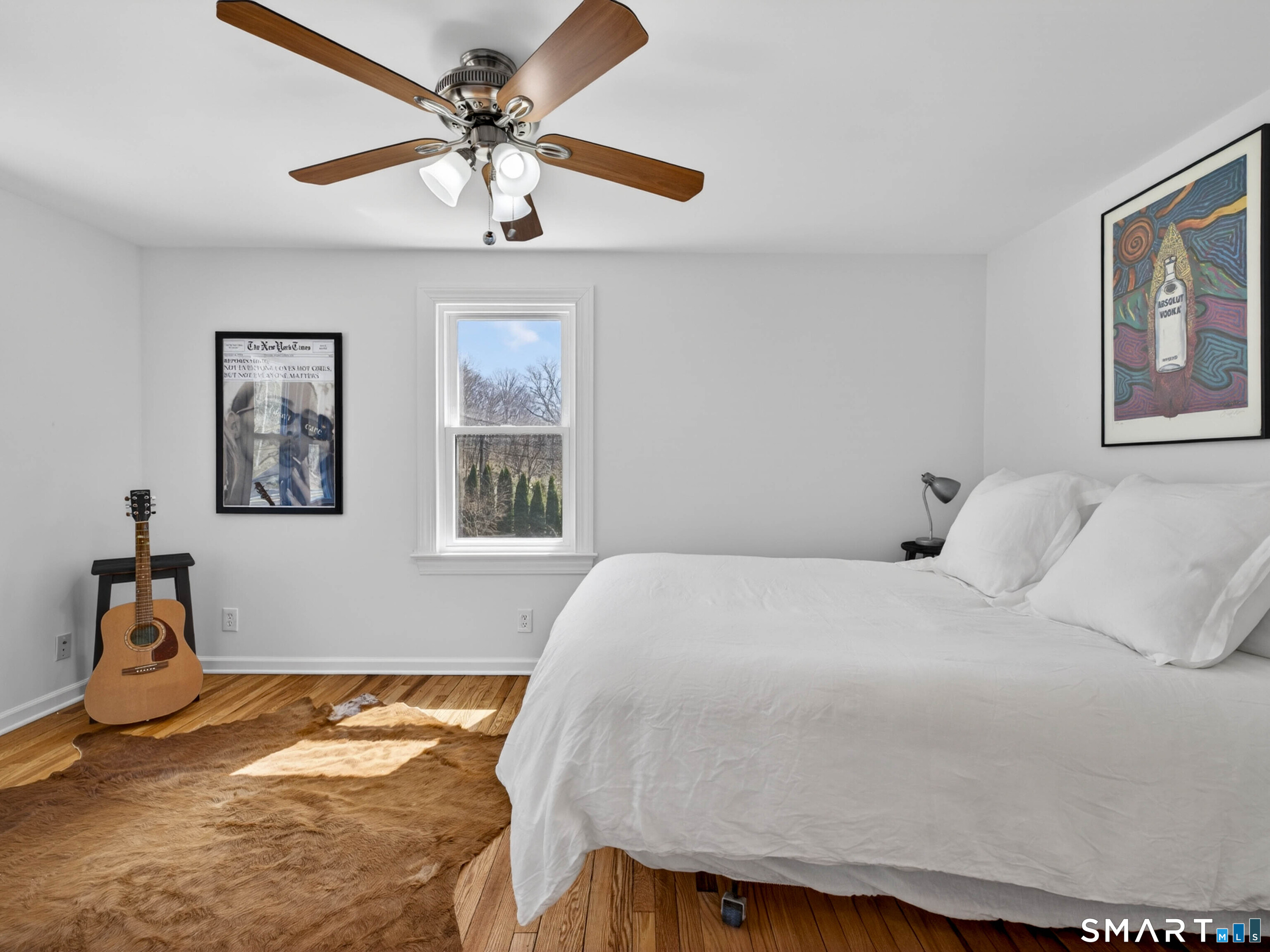 1092 Durham Road Guilford, CT 06437 - Photo 51 of 61 a bedroom with a bed and a chandelier