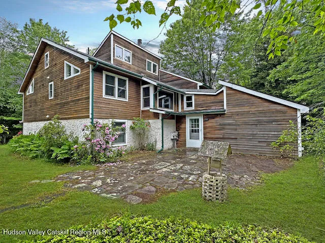 a kitchen with kitchen island a stove a sink and a refrigerator
