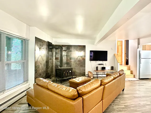 a living room with furniture and a table