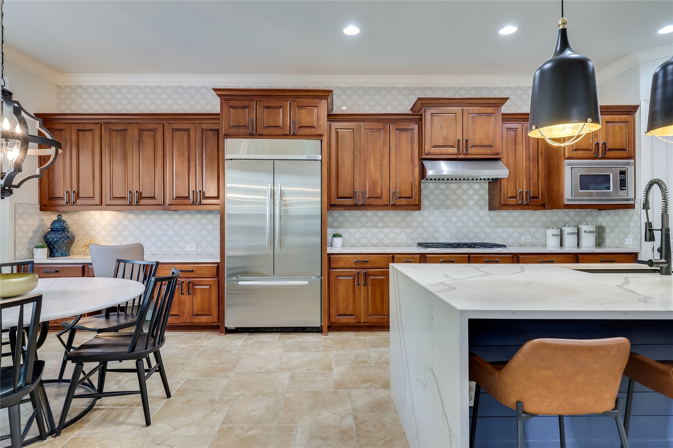 401 Bluff View Road Cedar Park, TX 78613 - Photo 22 of 40 Culinary dreams come alive in this kitchen, boasting rich wood cabinetry and ample counter space for inspired cooking.