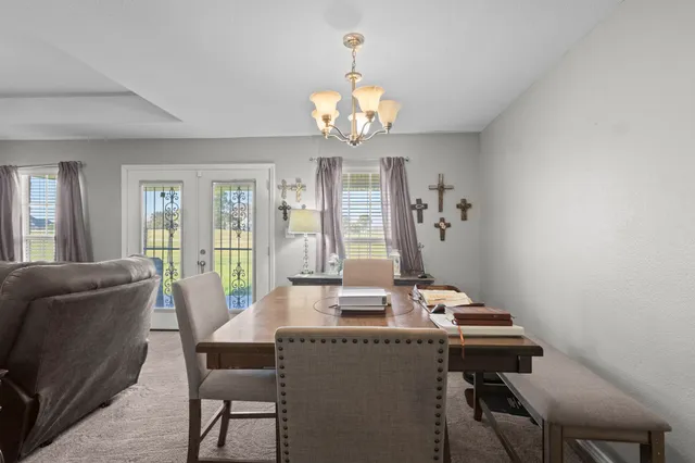a view of a dining room with furniture window and outside view