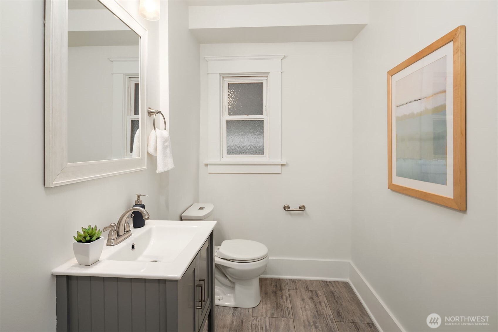 519 27th Avenue Seattle, WA 98122 - Photo 14 of 38 a bathroom with a sink a toilet and mirror