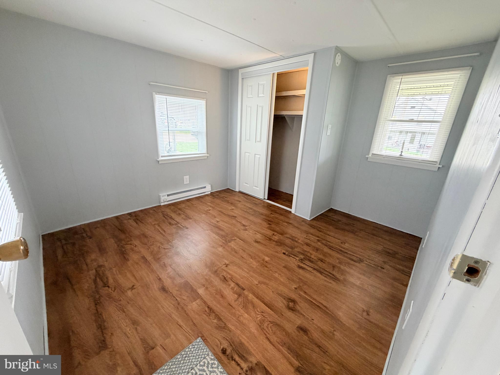217 Oak Street Wiconisco, PA 17048 - Photo 11 of 31 a view of an empty room with wooden floor and a window