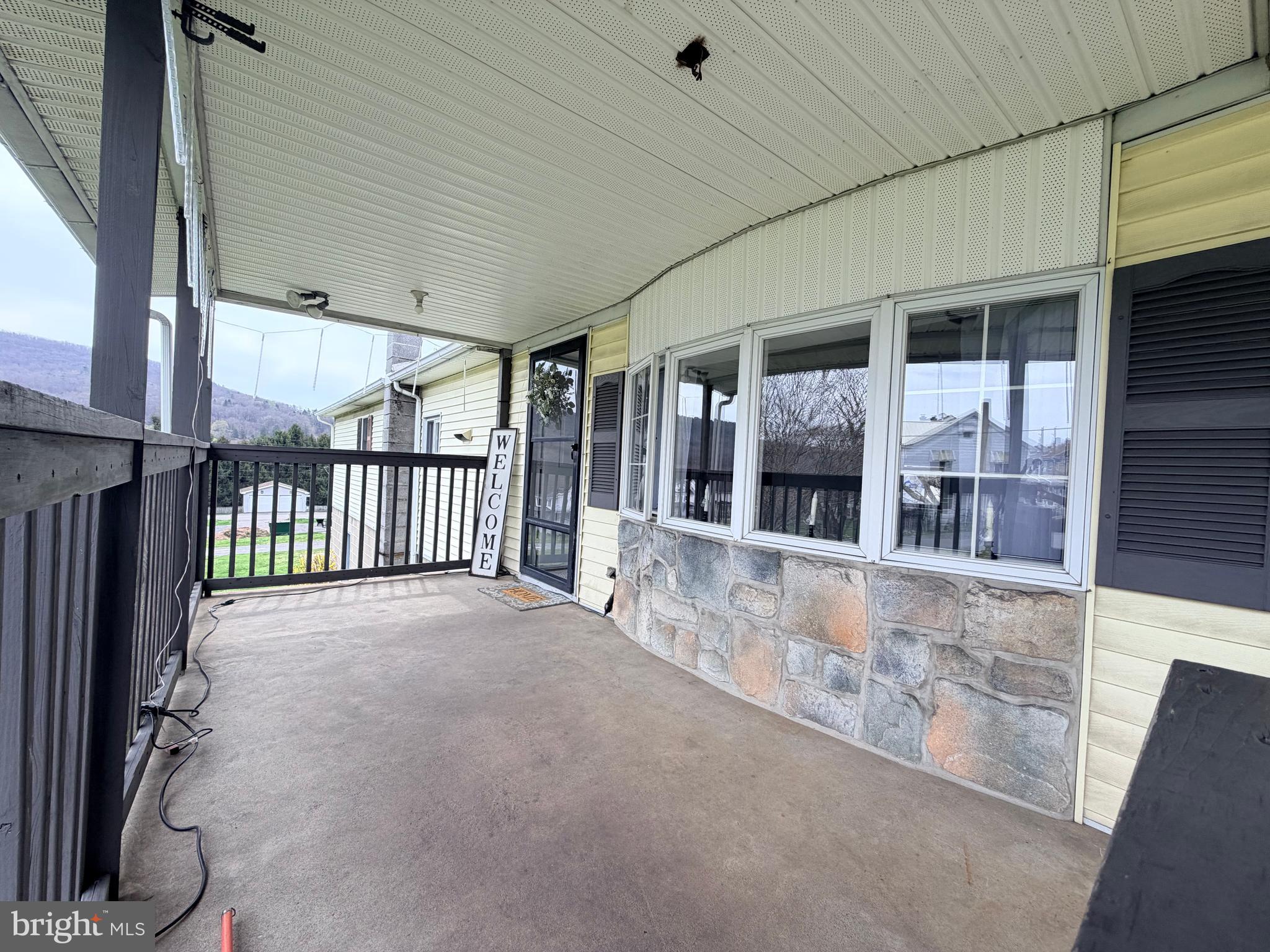 217 Oak Street Wiconisco, PA 17048 - Photo 7 of 31 a view of a porch with a table and chairs