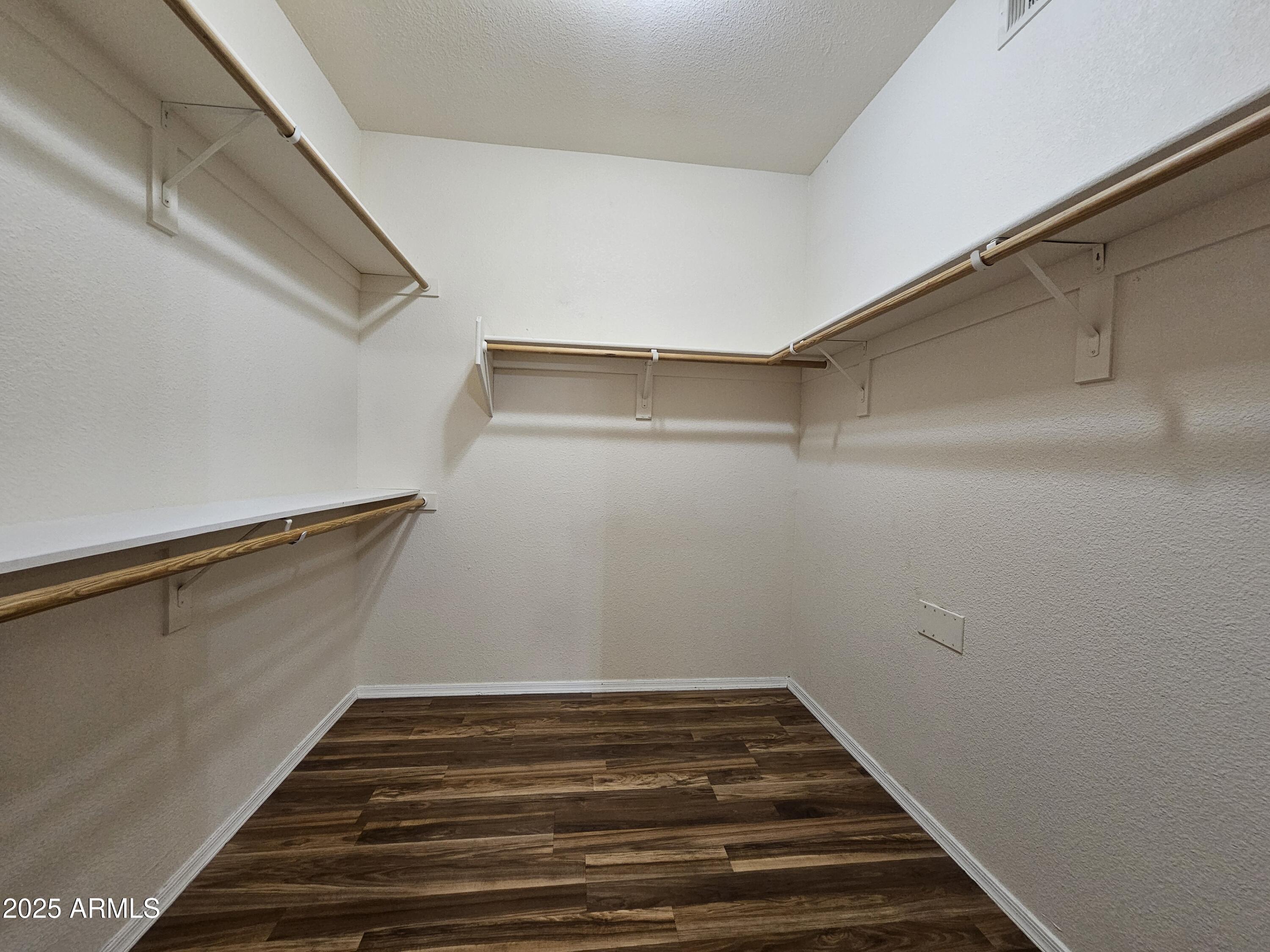 18416 North Cave Creek Road, Unit 1011 Phoenix, AZ 85032 - Photo 5 of 11 a view of a room with racks on the wall