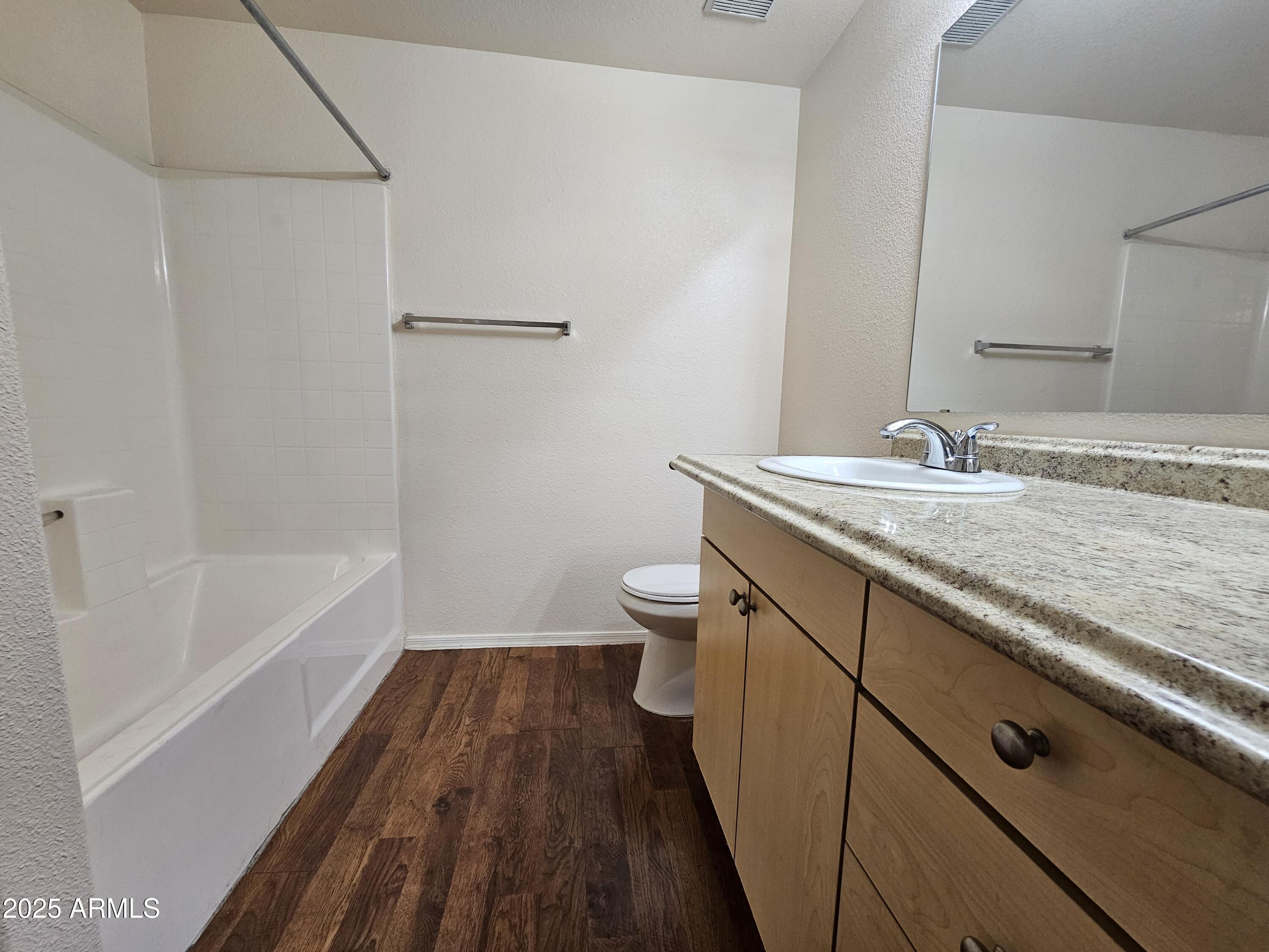 18416 North Cave Creek Road, Unit 1011 Phoenix, AZ 85032 - Photo 6 of 11 a bathroom with a sink a toilet and shower