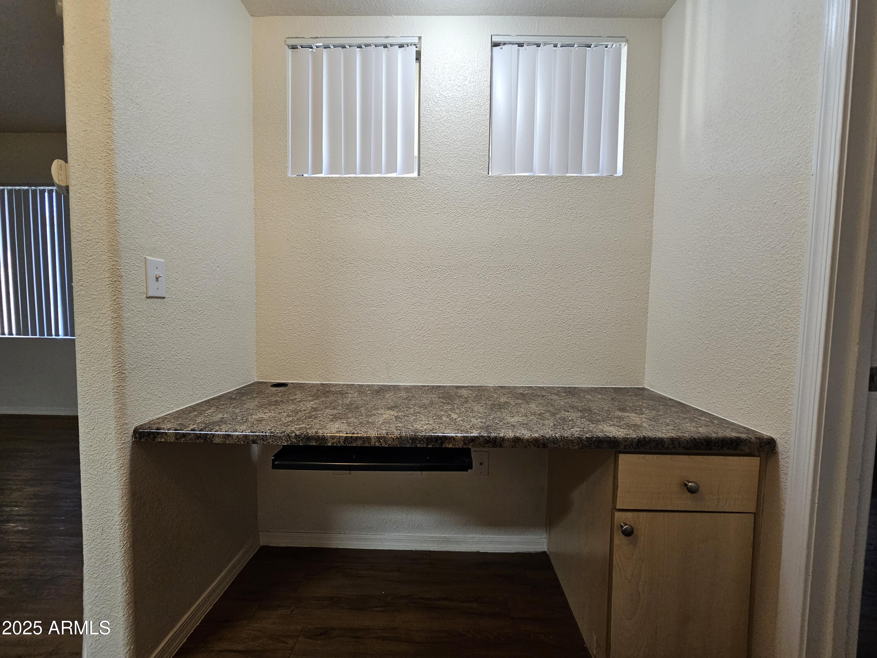 18416 North Cave Creek Road, Unit 1011 Phoenix, AZ 85032 - Photo 7 of 11 a room with granite countertop cabinets and sink