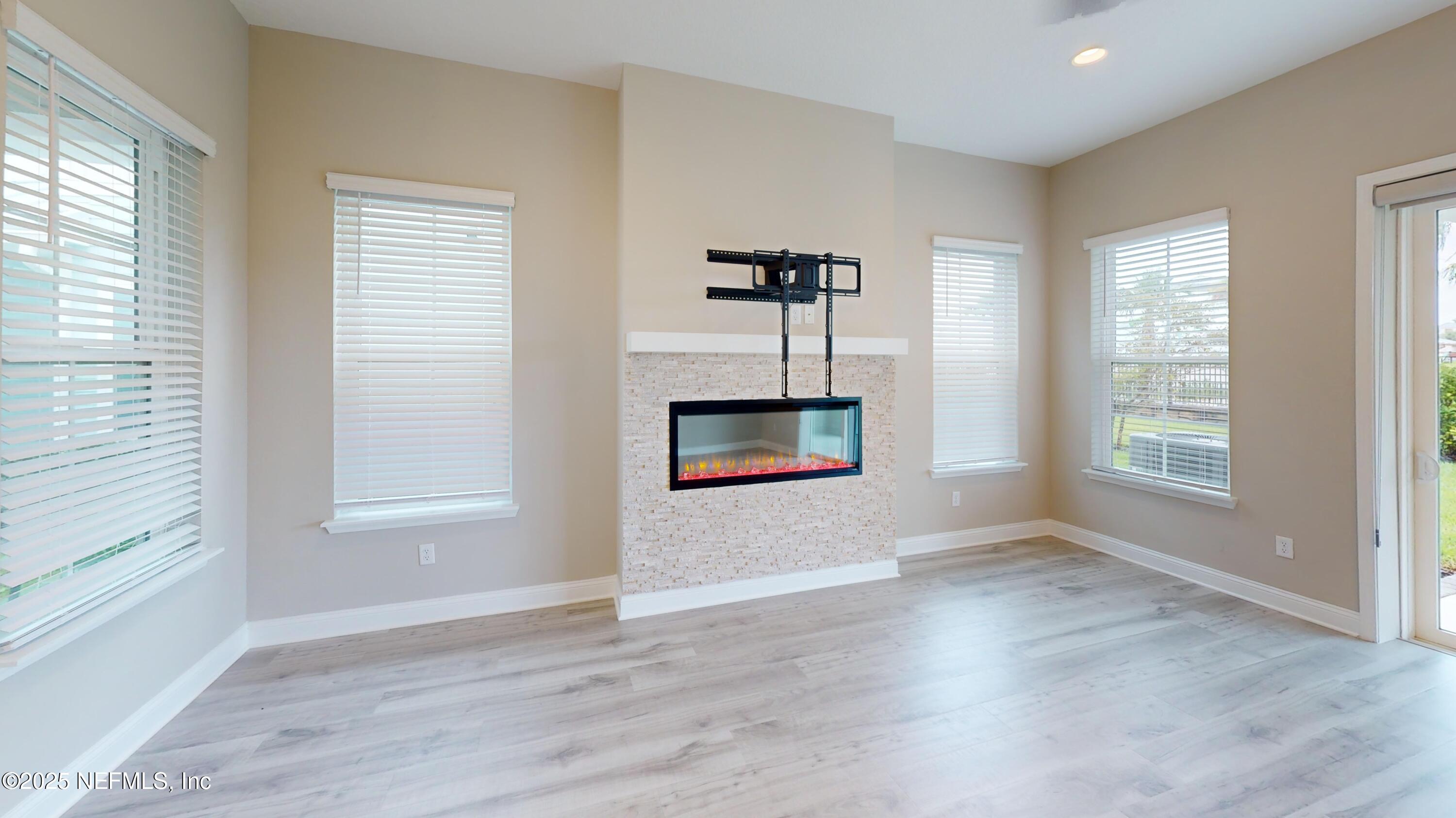 511 Marquesa Circle St. Johns, FL 32259 - Photo 11 of 44 a view of wooden floor and windows in a room