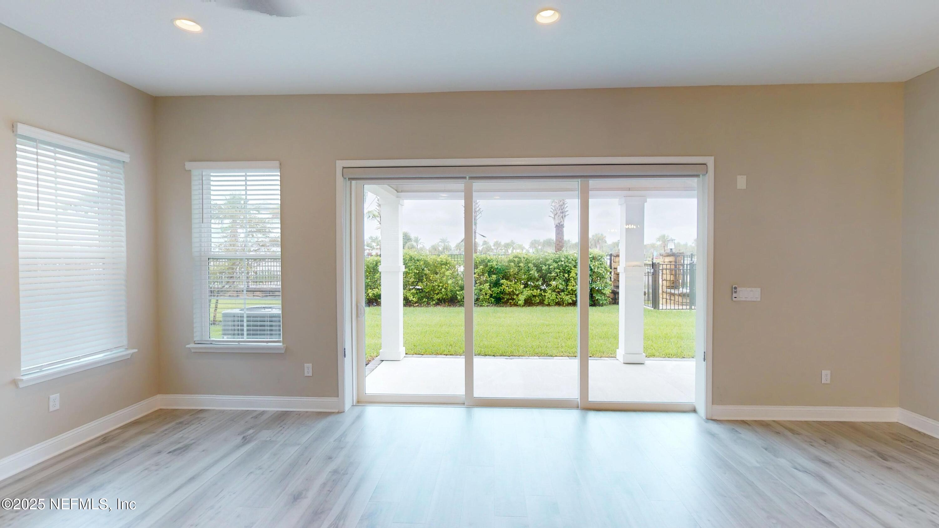 511 Marquesa Circle St. Johns, FL 32259 - Photo 13 of 44 a view of an empty room with wooden floor and a window