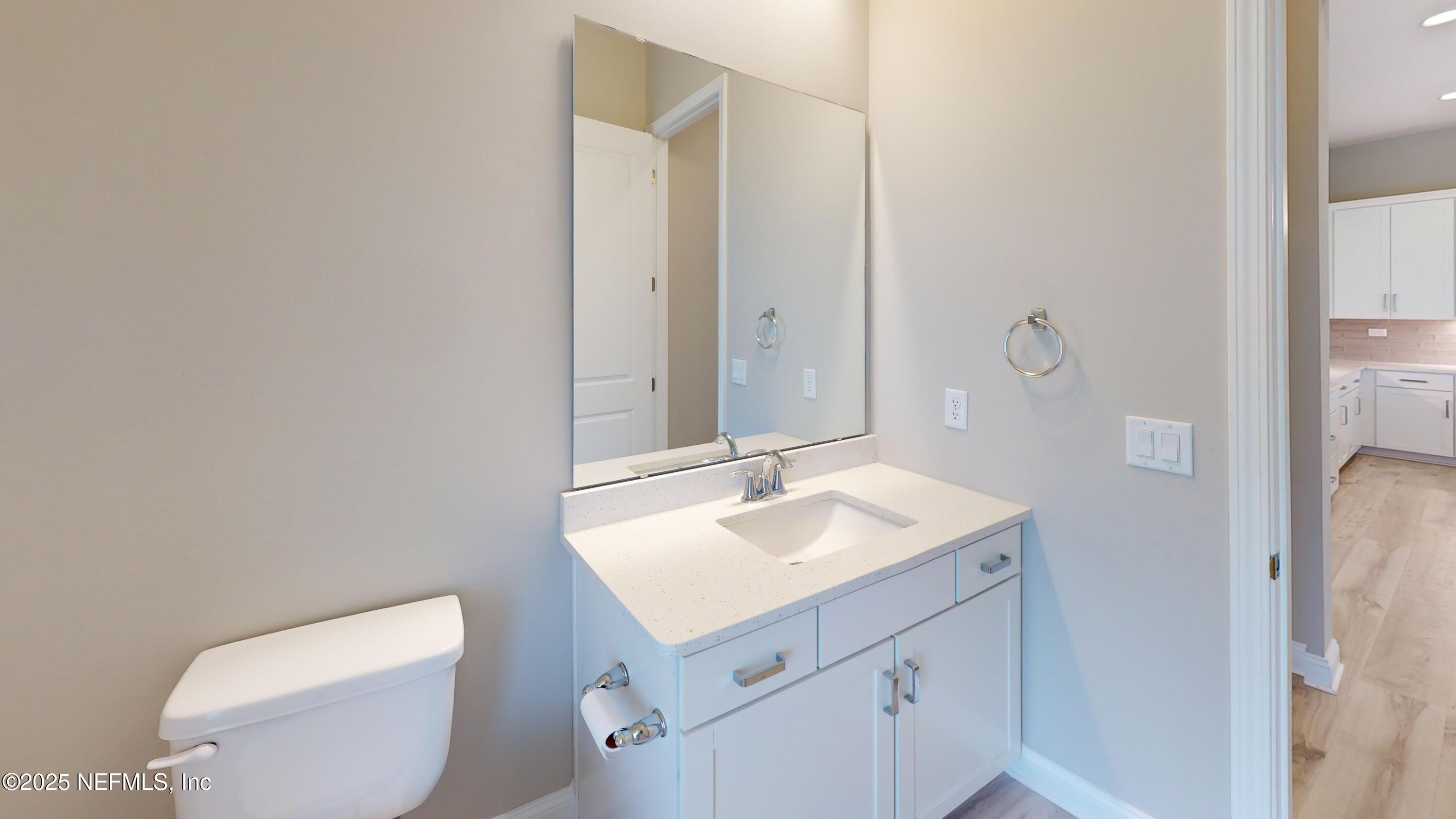 511 Marquesa Circle St. Johns, FL 32259 - Photo 14 of 44 a bathroom with a sink toilet and mirror