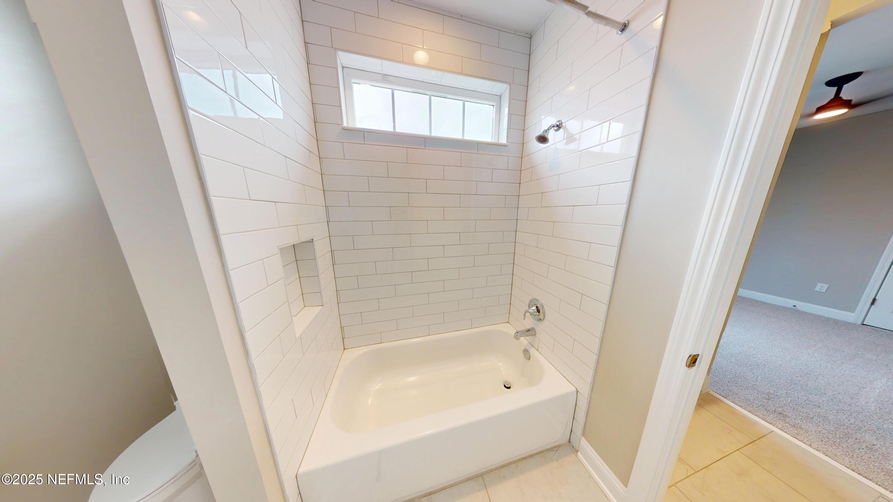 511 Marquesa Circle St. Johns, FL 32259 - Photo 21 of 44 a bathroom with a bathtub a shower and a sink