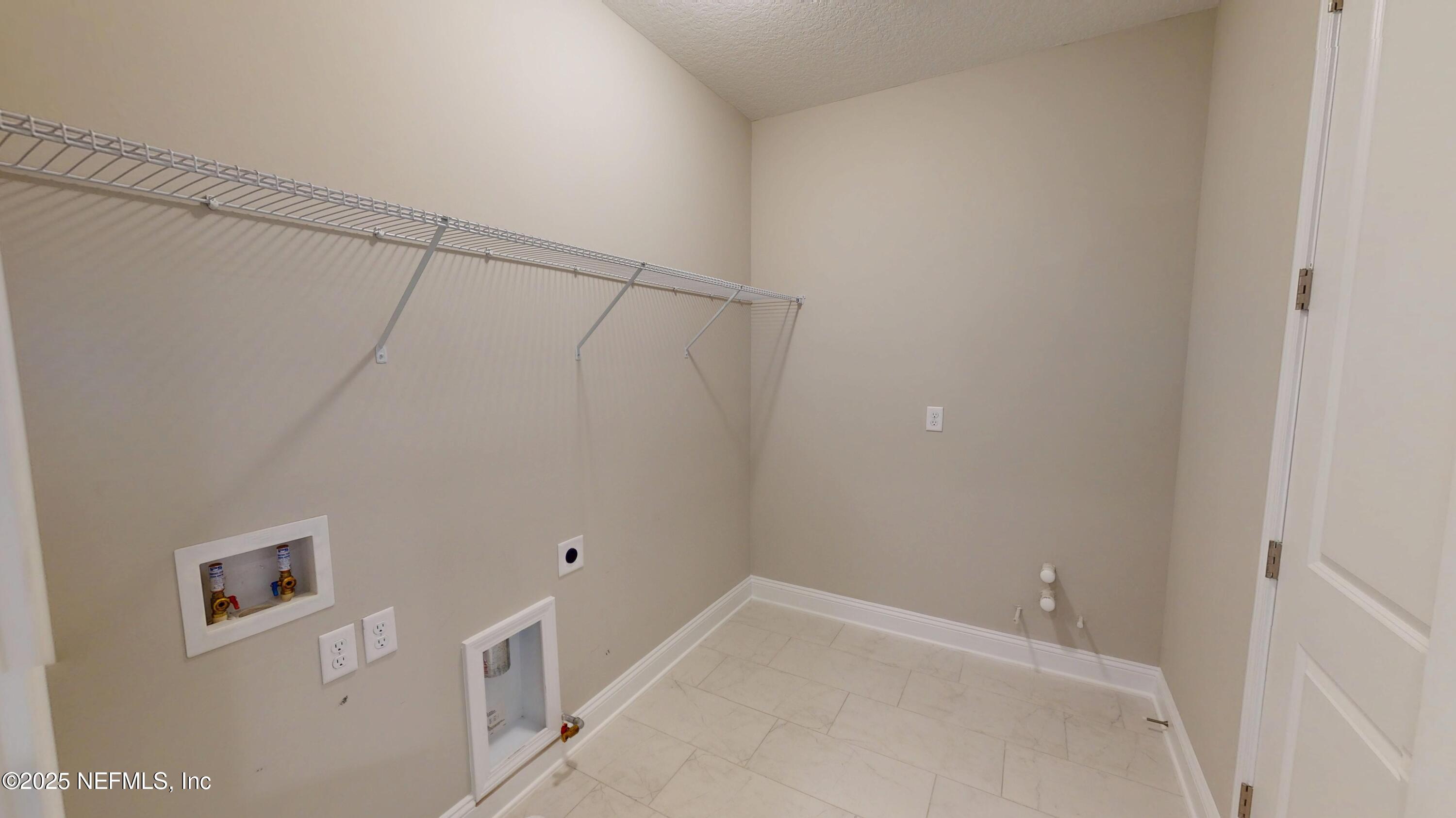 511 Marquesa Circle St. Johns, FL 32259 - Photo 23 of 44 a view of a room with racks on the wall
