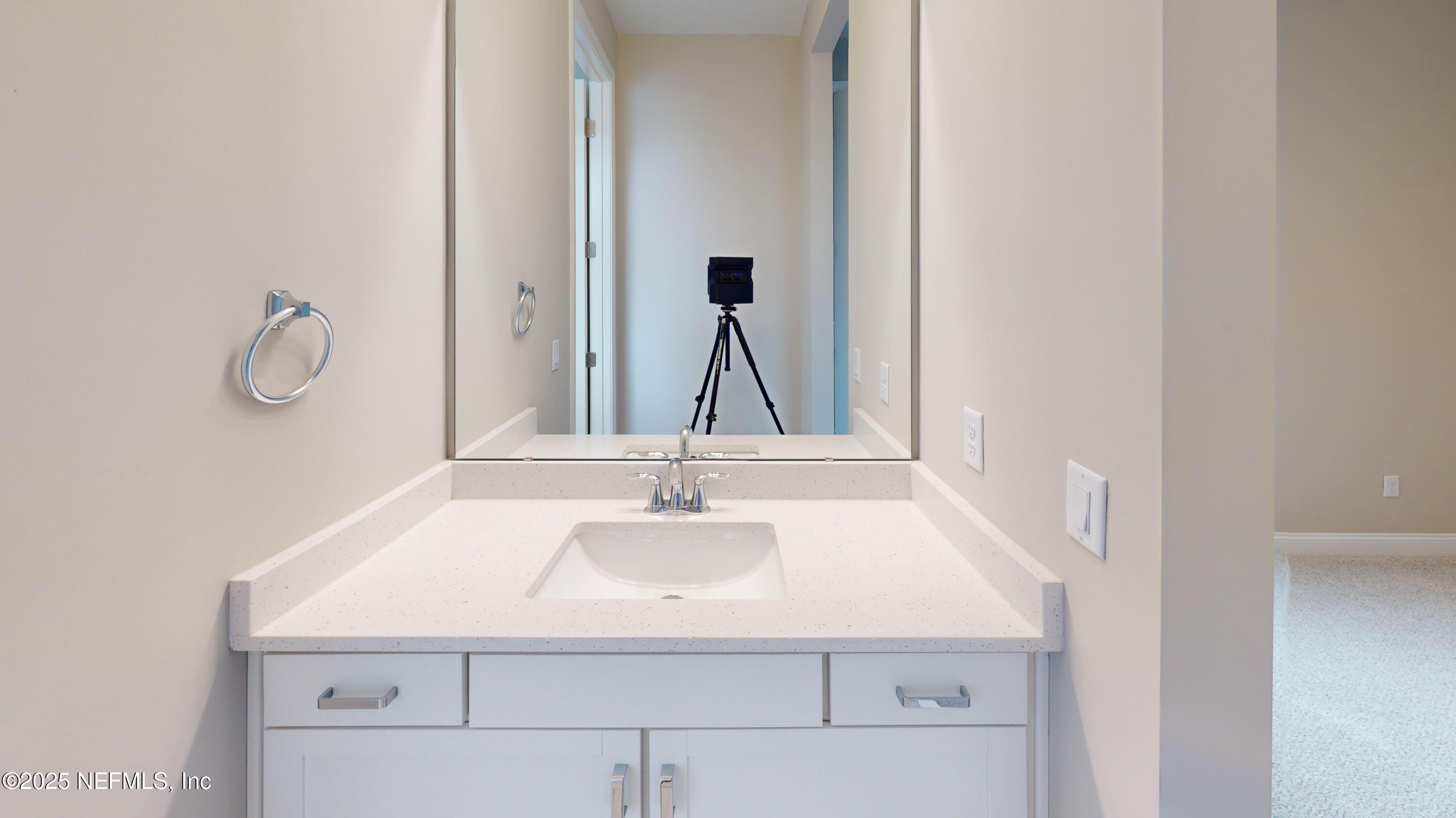 511 Marquesa Circle St. Johns, FL 32259 - Photo 30 of 44 a bathroom with a sink and a mirror