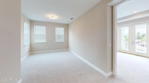 an empty room with windows