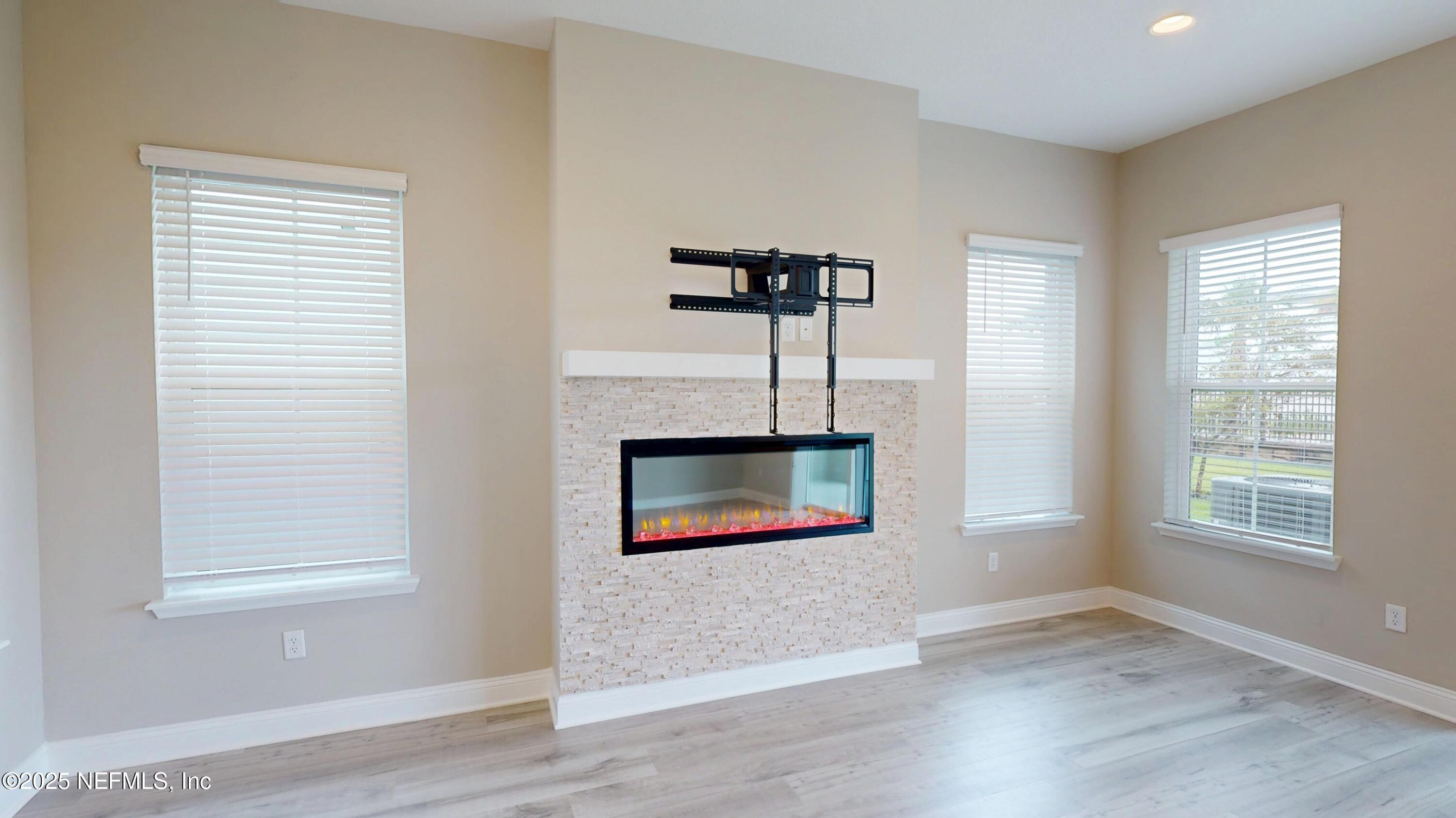 511 Marquesa Circle St. Johns, FL 32259 - Photo 10 of 44 a view of an empty room with a window and wooden floor