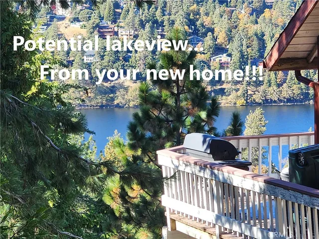 a balcony with table and chairs