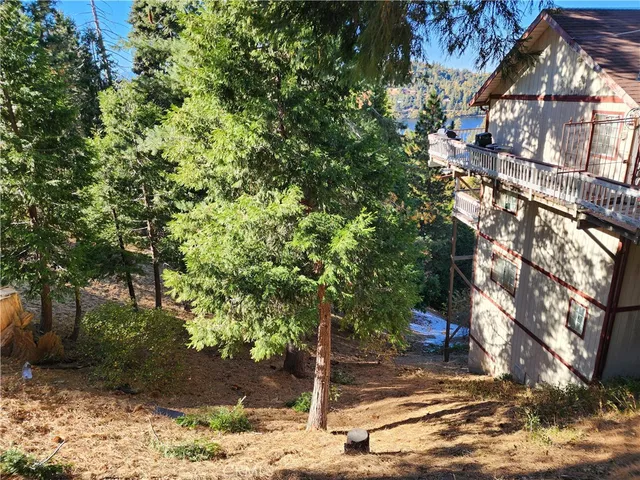 a view of a tree in front of a house