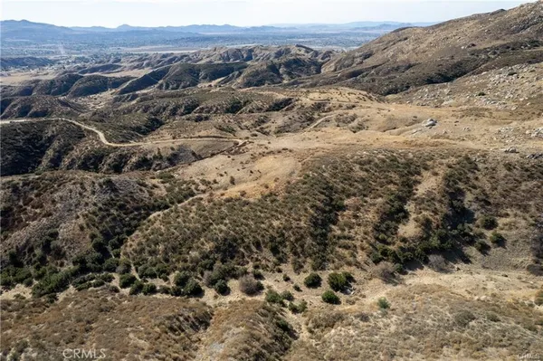 a view of a mountain range with trees