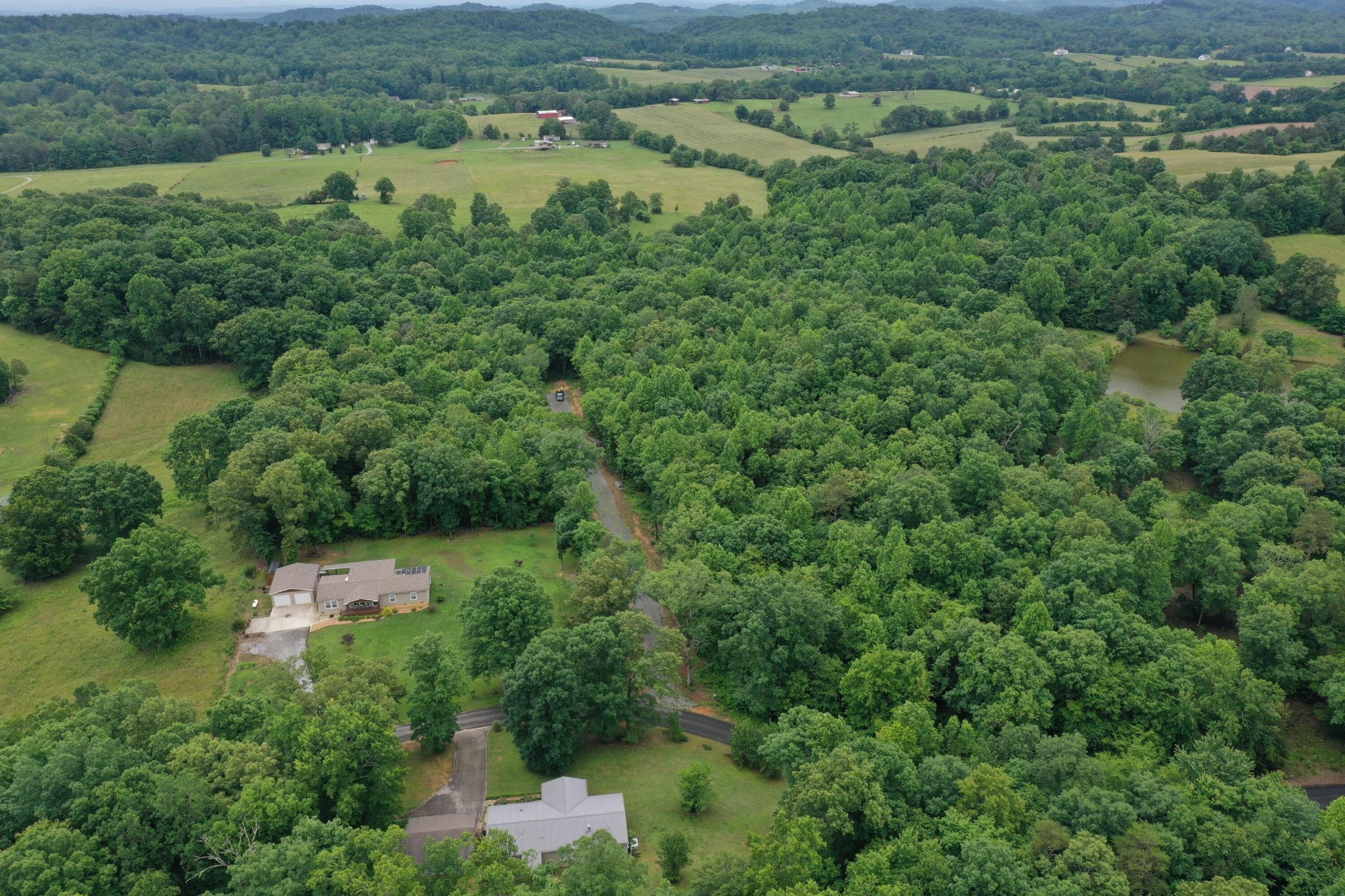 191 County Road 707 Athens, TN 37303 - Photo 2 of 7 an aerial view of residential house with outdoor space and trees all around