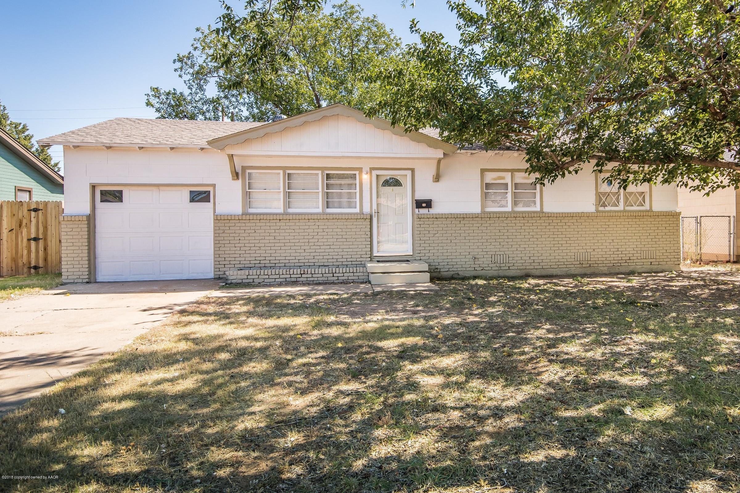 5137 South Bonham Street Amarillo, TX 79110 - Photo 1 of 18 a front view of a house with a garden