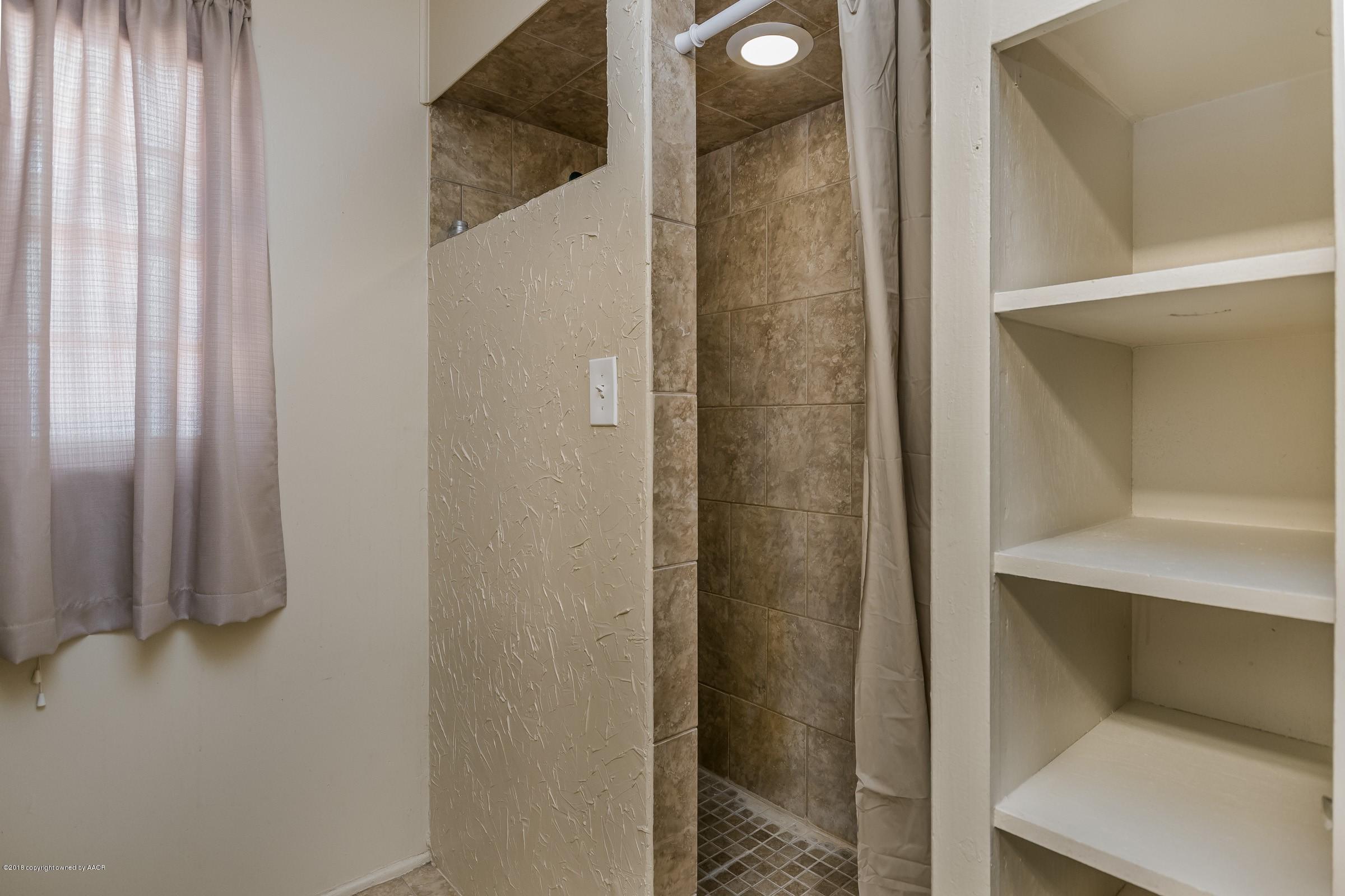 5137 South Bonham Street Amarillo, TX 79110 - Photo 12 of 18 a bathroom with a shower