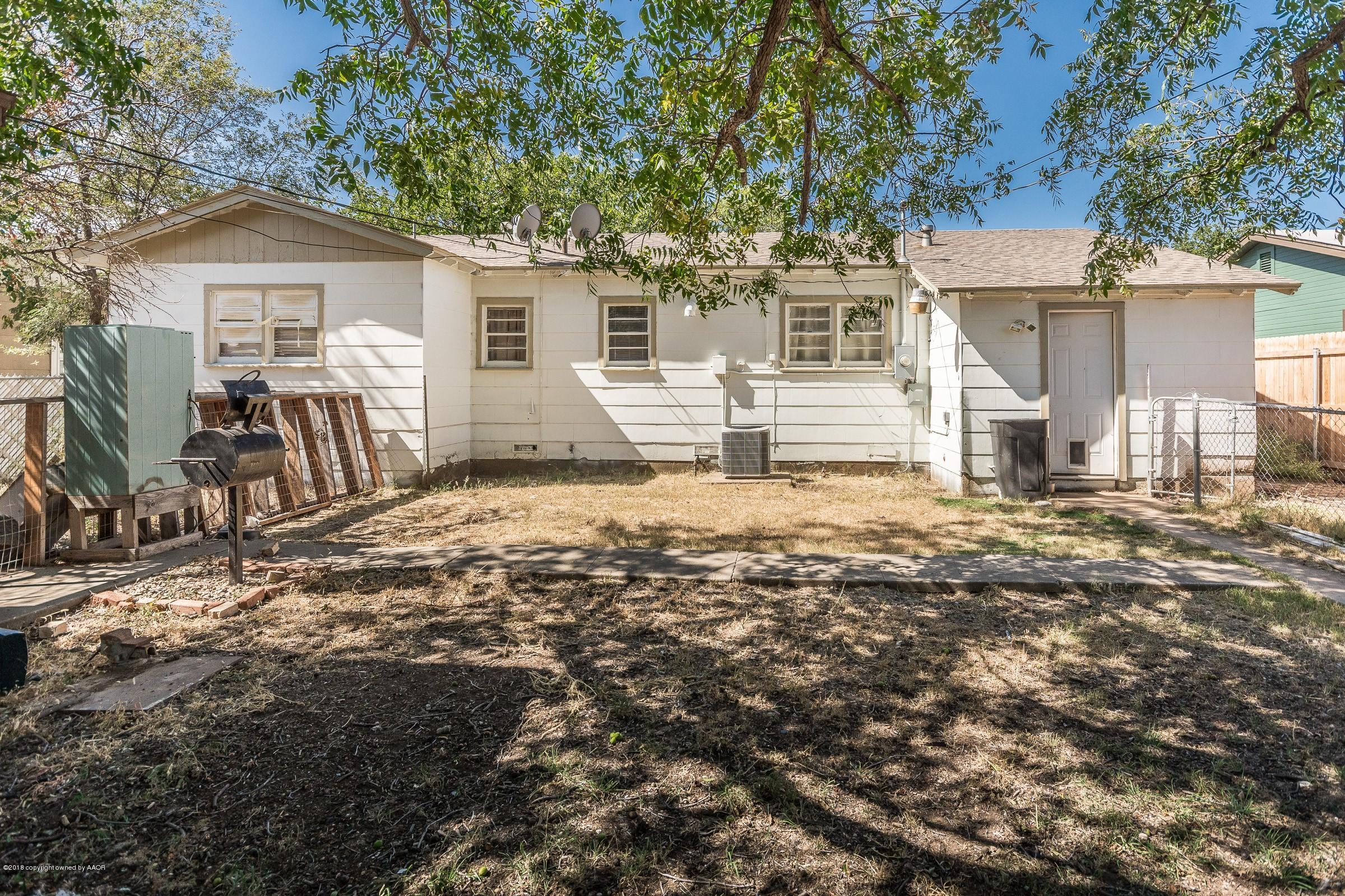 5137 South Bonham Street Amarillo, TX 79110 - Photo 15 of 18 a front view of a house with a yard