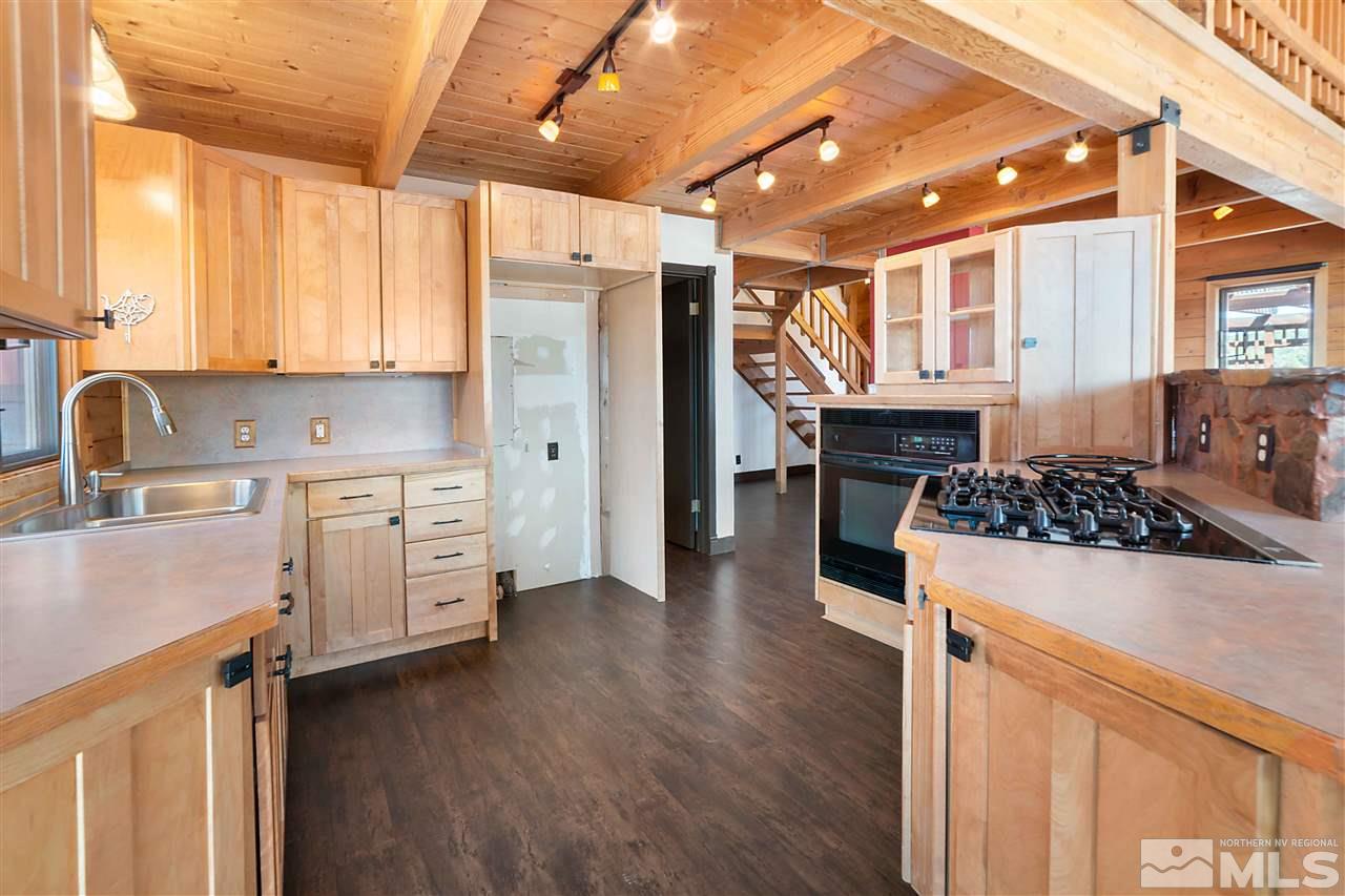 3880 Stovepipe Road Reno, NV 89521 - Photo 5 of 40 a kitchen with stainless steel appliances a stove a sink and a refrigerator