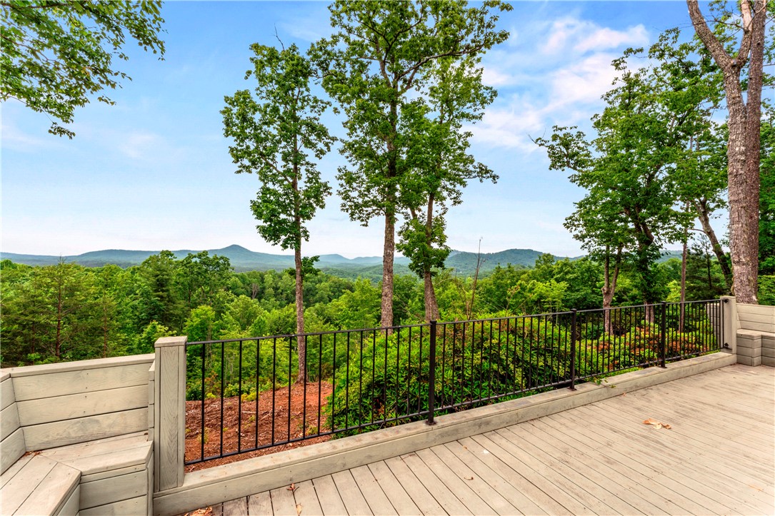 110 Gabriel Way Pickens, SC 29671 - Photo 40 of 48 A spacious deck at the Community Center overlooks an endless panorama of lush green mountains under an expansive sky.