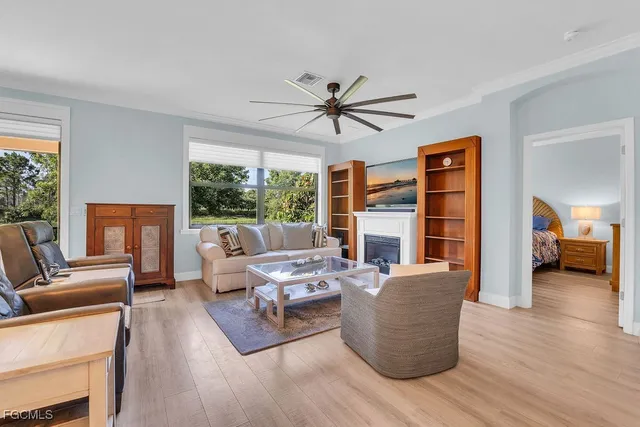 a living room with furniture and a large window