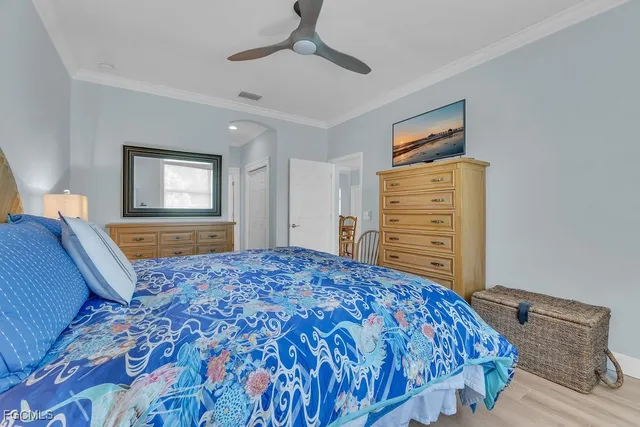 a bedroom with a bed and dresser