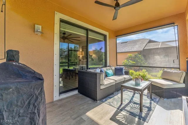 a living room with furniture and a window